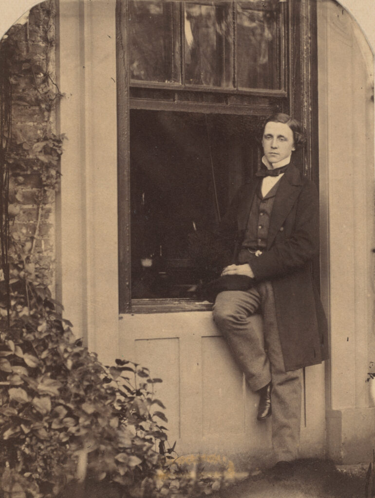 "Lewis Carroll, Lewis Carroll Seated on a Windowsill of the Old Rectory at Croft, Darlington, Yorkshire, 1857 ลูอิส แคร์รอล